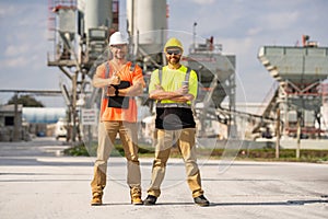 Professional heavy industry engineer workers in safety uniform and hard hat helmet. Factory engineer. Manufacturing