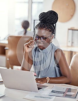 Professional help from the first hello. a young woman using a headset and laptop in a modern office.