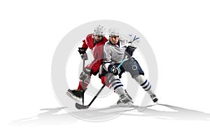 Professional hockey player skating on ice. Isolated in white