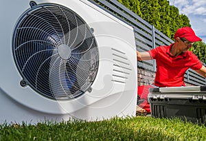 Professional HVAC Worker Installing Swimming Pool Heat Pump