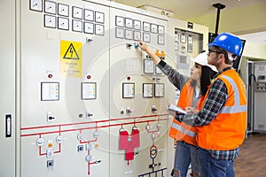 Professional industrial engineers operating in electricity substation