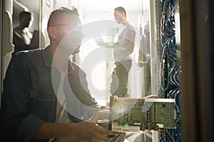 IT professional installing blade server