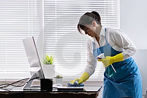 Professional janitors cleaning office photo