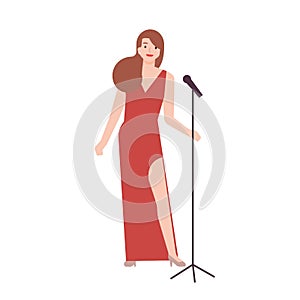 Professional jazz singer, vocalist or songstress wearing elegant red evening dress and holding microphone stand. Female