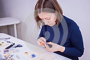 Designer making handmade eardrop photo