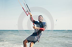 Professional kiter makes the difficult trick on a beautiful background.
