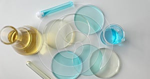 Professional laboratory glassware with liquid on table