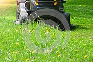 Professional lawn mower grass cutting close up