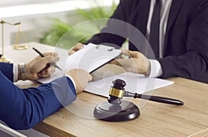 Professional lawyer providing legal services and helping his client with documents