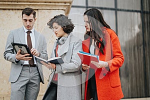 Professional lawyers having an outdoor business meeting discussing legal matters