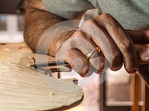 Professional luthier violinmaker artisan working on making a handmade violin with ancient tradtitional Stradivarius craftmanship