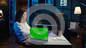 IT professional maintaining company systems using mockup notebook photo
