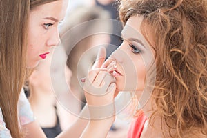 Professional Make-up artist doing glamour model