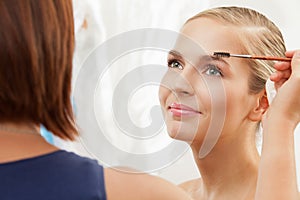 Professional makeup artist working photo