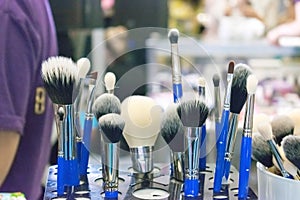 Professional makeup brushes and tools on stand. Makeup artist, f