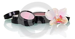 Professional makeup: eye shadow, blush and orchid flower isolated.