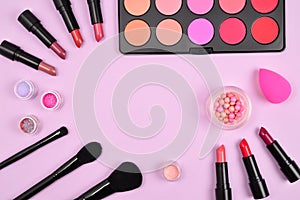 Professional makeup products with cosmetic beauty products, blushes, eye liner, eye lashes, brushes and tools