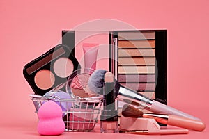 Professional makeup tools. Makeup products on pink background. A set of various products for makeup