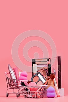 Professional makeup tools. Makeup products on pink background. A set of various products for makeup