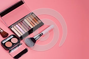 Professional makeup tools. Products for makeup on pink background. A set of various products for makeup