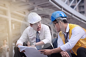 Professional male and business engineers working and discuss wit