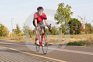 Professional Male Cyclist in Racing Outfit During a Ride