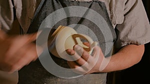 Professional male potter working in workshop