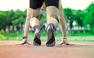 Professional male runner taking ready to start position