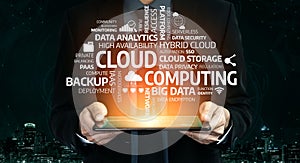 Professional Man Holding Tablet with Cloud Computing Concepts, Data Security, Analytics, Storage, and Management