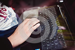 Professional man with a laptop in car tunes tuning control system