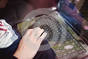 Professional man with a laptop in car tunes tuning control system