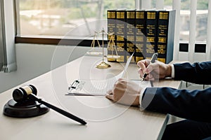 Professional man lawyers work at a law office There are scales, Scales of justice, judges gavel, and litigation documents.