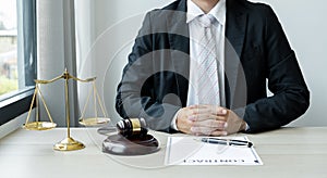 Professional man lawyers work at a law office There are scales, Scales of justice, judges gavel, and litigation documents.