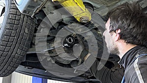 professional man mechanic repair auto at service station. 4K