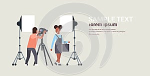 Professional man photographer using dslr camera on tripod shooting african american woman model girl posing modern photo