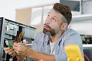 professional man repairing and assembling computer
