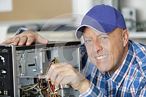 professional man repairing and assembling computer