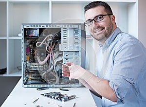 Professional man repairing and assembling a computer