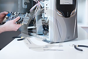 Professional man repairing and assembling a computer