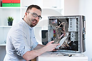 Professional man repairing and assembling a computer desktop