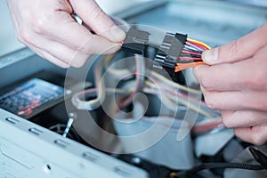 Professional man repairing computer