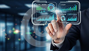 Businessman analyzing data on virtual screen.