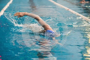 Professional man swimmer swims