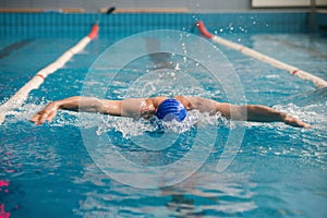 Professional man swimmer swims