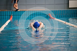 Professional man swimmer swims