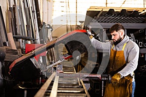 Professional man worker during work in workshop