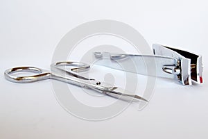 Professional manicure tools on a gray background. Nail scissors and nippers