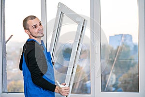 Professional master at repair and installation of windows, at work