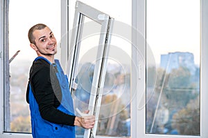 Professional master at repair and installation of windows, at work