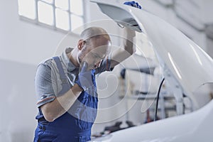 Professional mechanic doing a car inspection